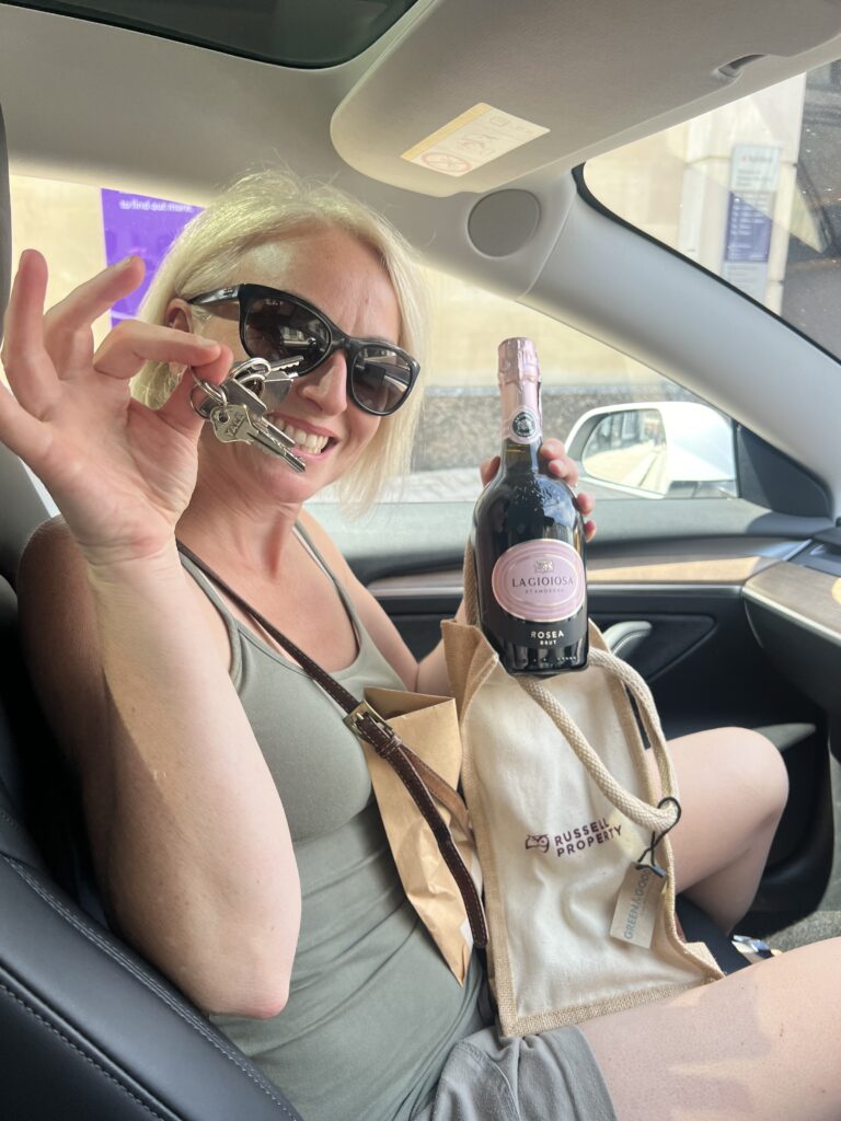 woman celebrating with her new house keys